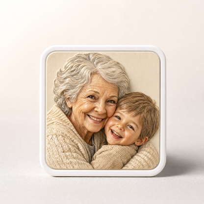 Youvfy ceramic fridge magnet showing a grandmother and grandchild in a warm hug