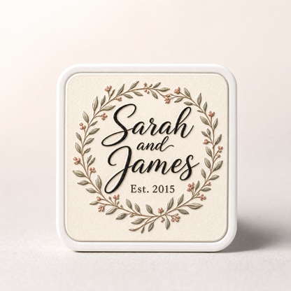 Youvfy ceramic fridge magnet with elegant calligraphy 'Sarah and James, Est. 2015' and a floral wreath