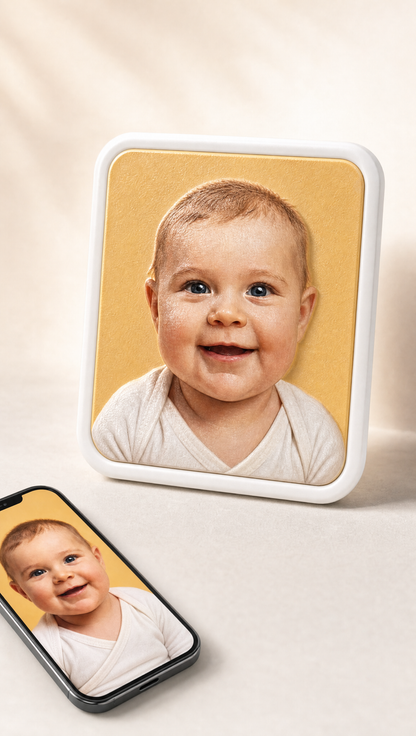 Youvfy baby magnet standing beside a smartphone showing the original baby photo — your photo becomes your magnet